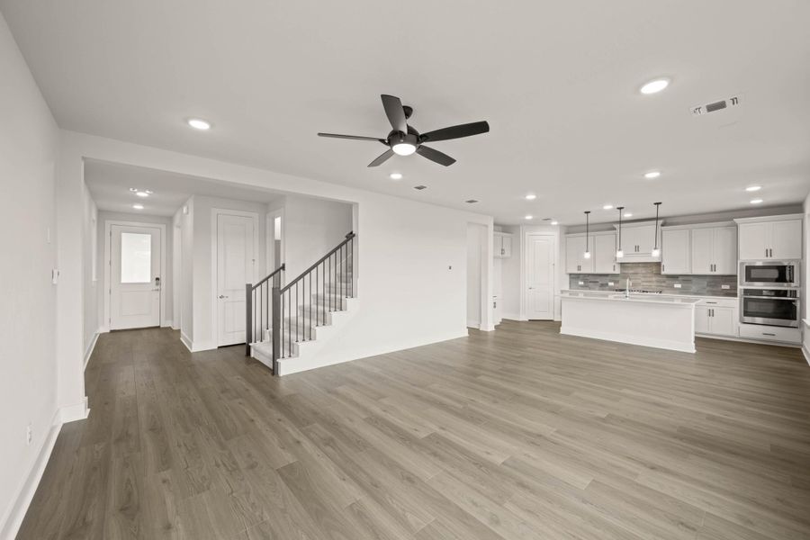 Spacious, unfurnished interior of a new home in Cottage Collection at Harvest, Argyle (Image 14).