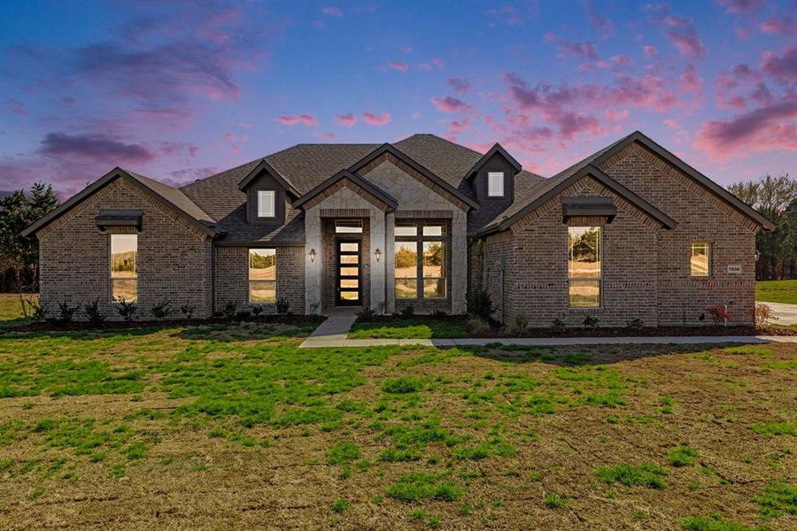 Front exterior of a new home in , Midlothian, TX, highlighting curb appeal (Image 1). Front exterior of a new home in , Midlothian, TX, highlighting curb appeal (Image 1).
