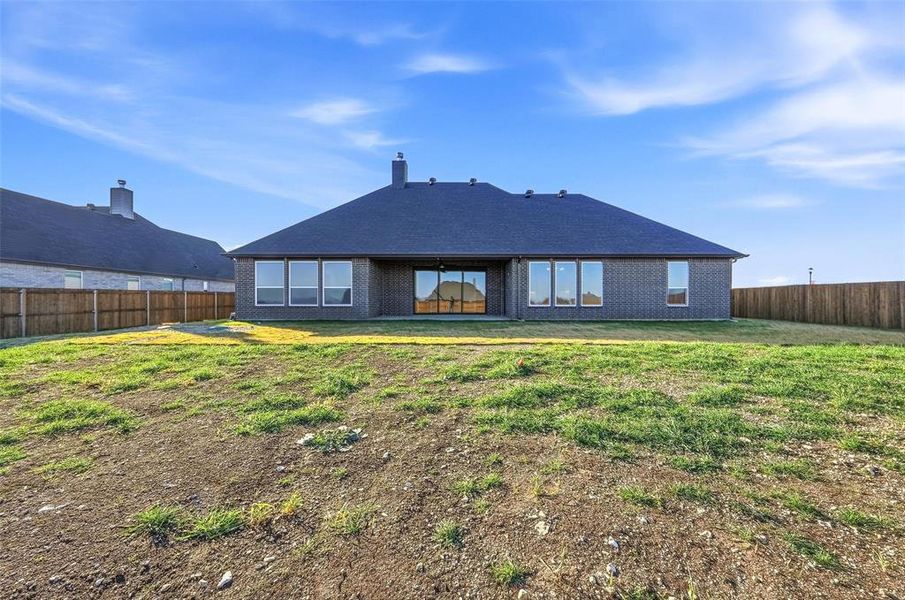 Exterior details and patio area of a home in Coyote Crossing, Godley (Image 29).