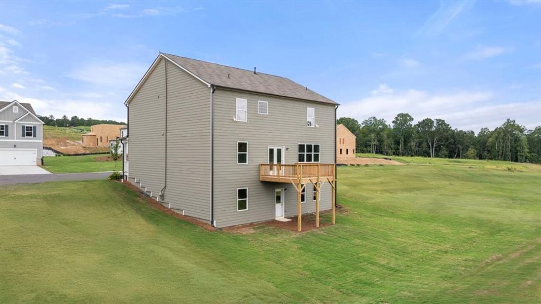 Front exterior of a new home in Sheffield Highlands, Dallas, GA, highlighting curb appeal (Image 25).