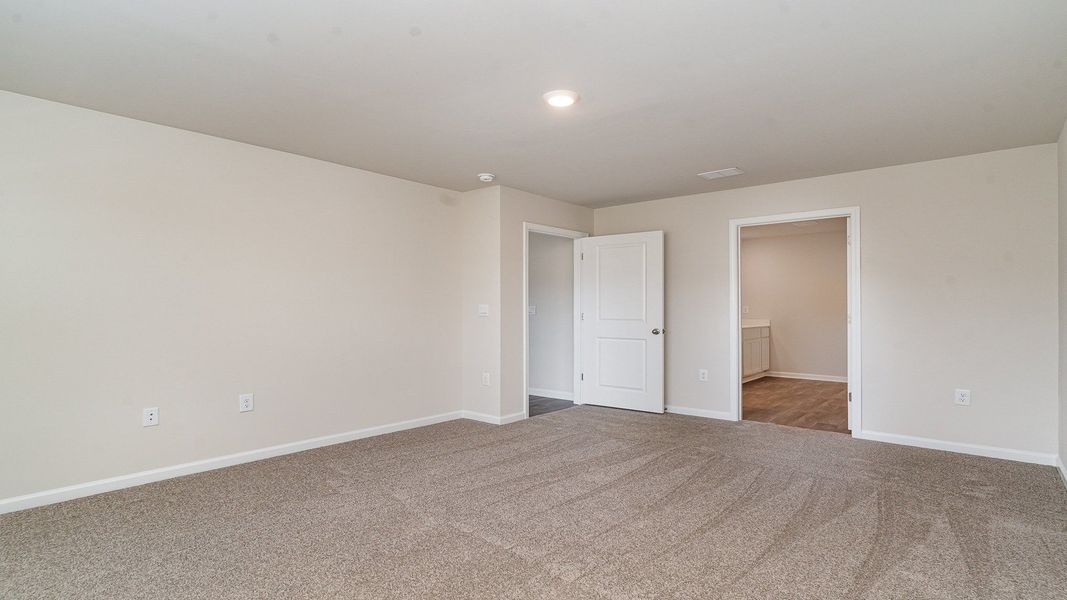 Spacious, unfurnished interior of a new home in Stanbury Creek, Supply (Image 18).