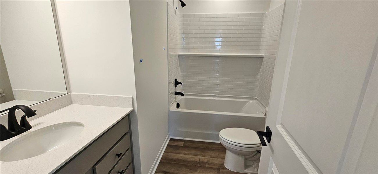 This newly renovated bathroom features modern fixt This newly renovated bathroom features modern fixt