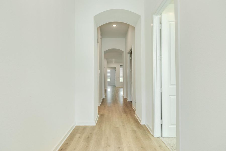 As you make your way to the family area, on your right, you will find the spacious media room featuring elegant double doors, perfect for private screenings and quiet entertainment.