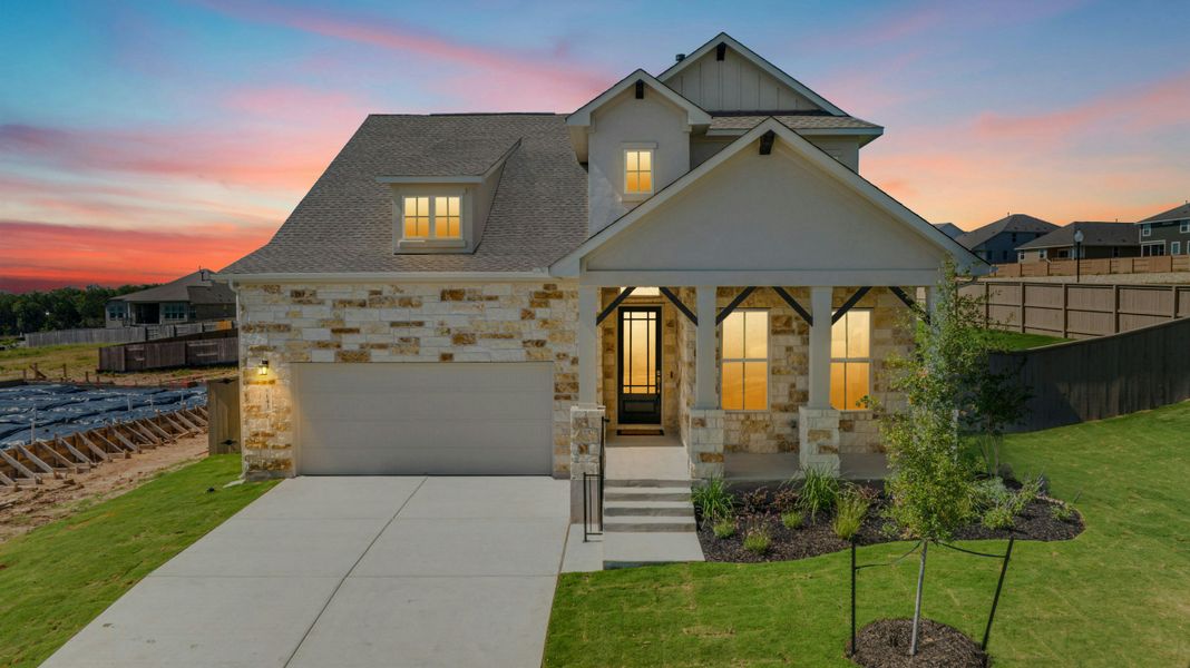 Front exterior of a new home in The Colony, Bastrop, TX, highlighting curb appeal (Image 1). Front exterior of a new home in The Colony, Bastrop, TX, highlighting curb appeal (Image 1).