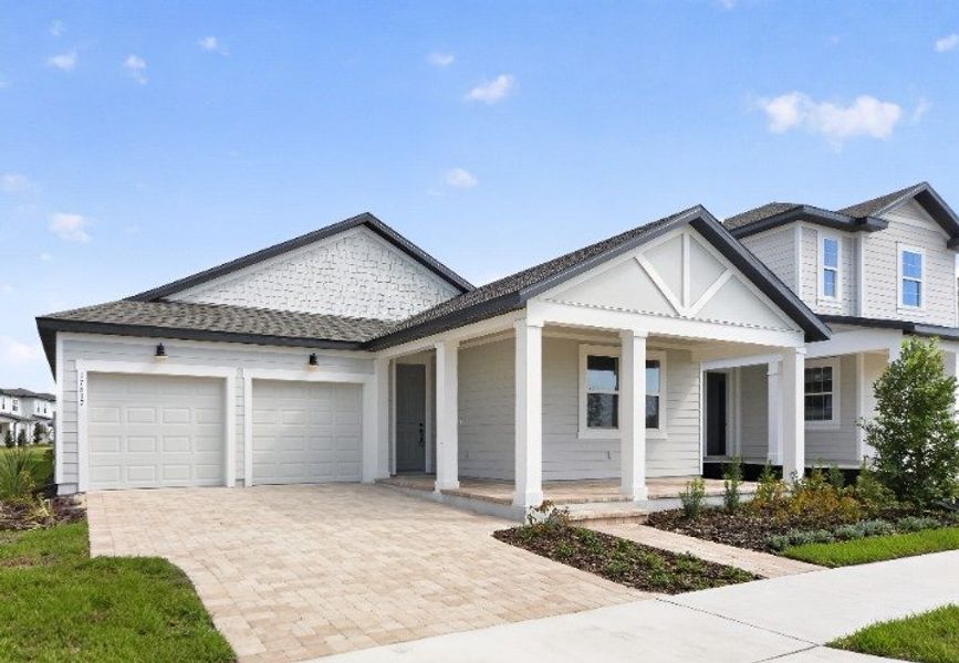 Front exterior of a new home in Northlake at Ovation, Winter Garden, FL, highlighting curb appeal (Image 2). Front exterior of a new home in Northlake at Ovation, Winter Garden, FL, highlighting curb appeal (Image 2).