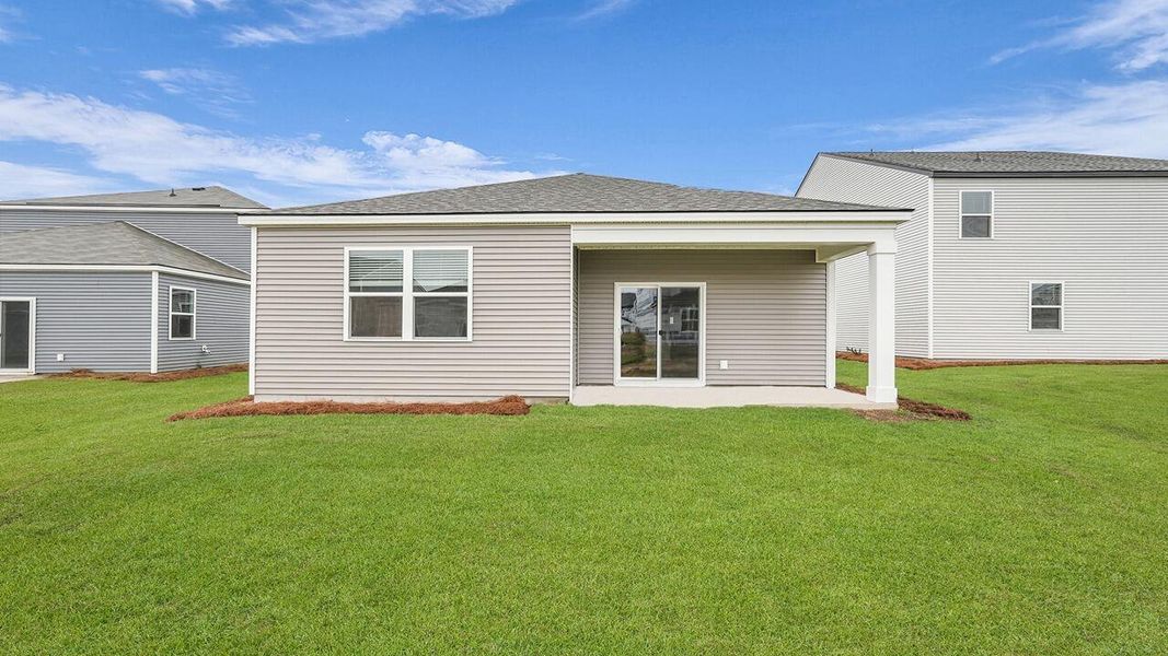 Exterior details and patio area of a home in Pine Hills at Cane Bay, Summerville (Image 2).