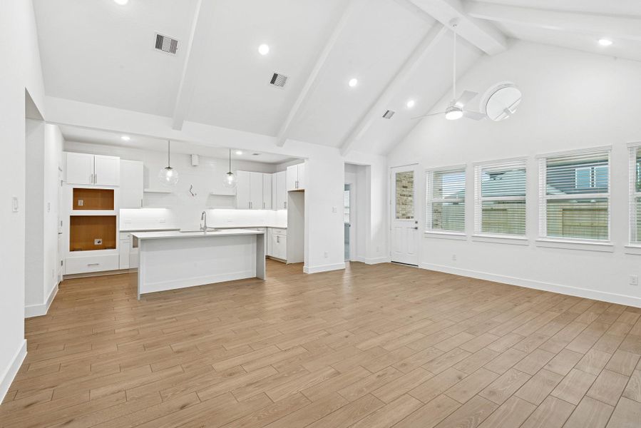 High vaulted ceilings with painted beams in the living area