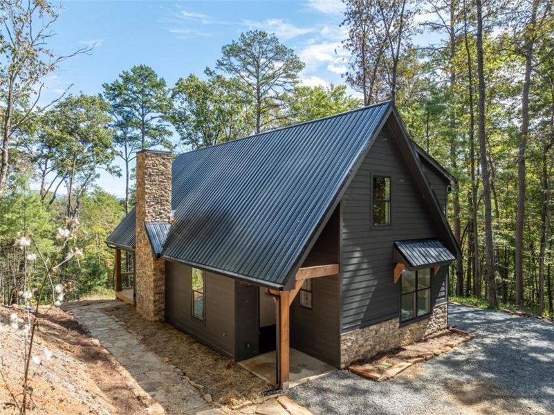 Exterior details and patio area of a home in , Ellijay (Image 33).