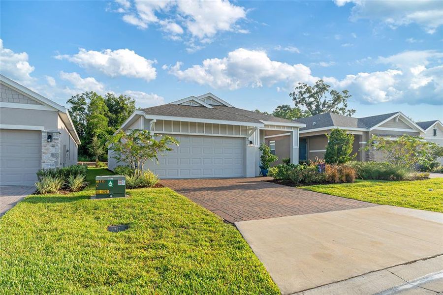 Front exterior of a new home in Ocala Preserve, Ocala, FL, highlighting curb appeal (Image 20).