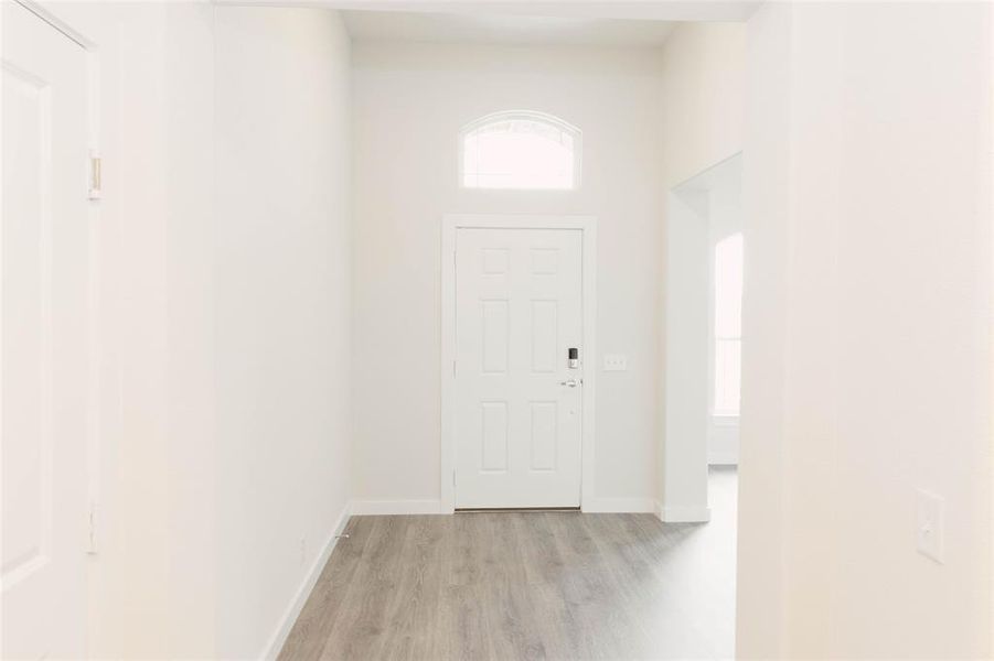 Foyer with light wood-type flooring