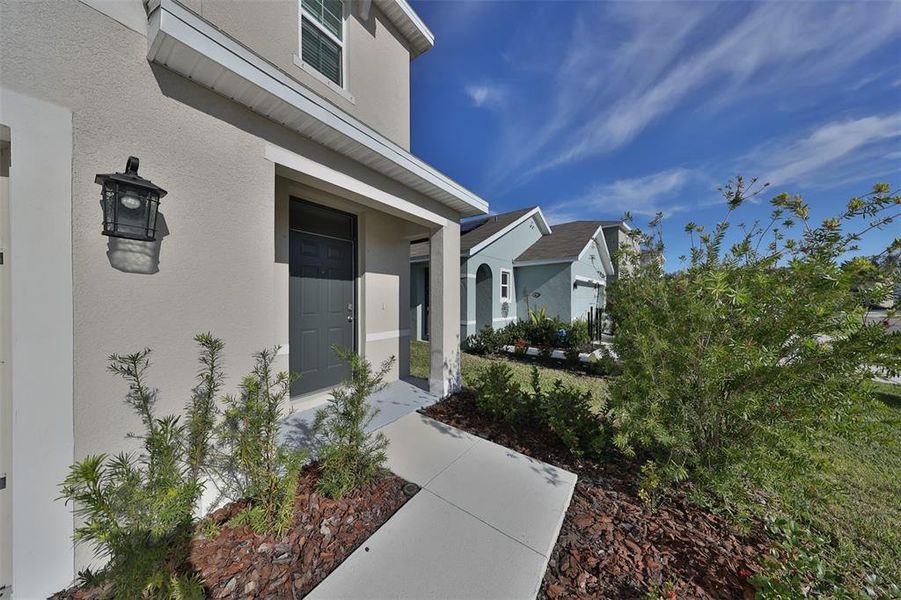 Front exterior of a new home in Southshore Bay, Wimauma, FL, highlighting curb appeal (Image 1). Front exterior of a new home in Southshore Bay, Wimauma, FL, highlighting curb appeal (Image 1).