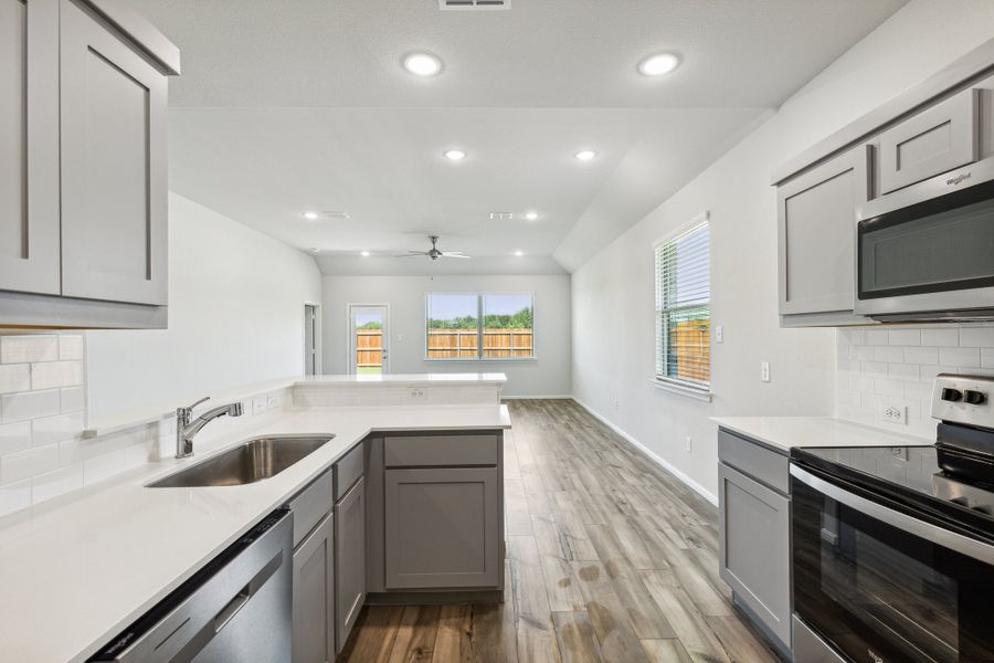 Kitchen in the Sapphire home plan by Trophy Signature Homes – REPRESENTATIVE PHOTO Kitchen in the Sapphire home plan by Trophy Signature Homes – REPRESENTATIVE PHOTO