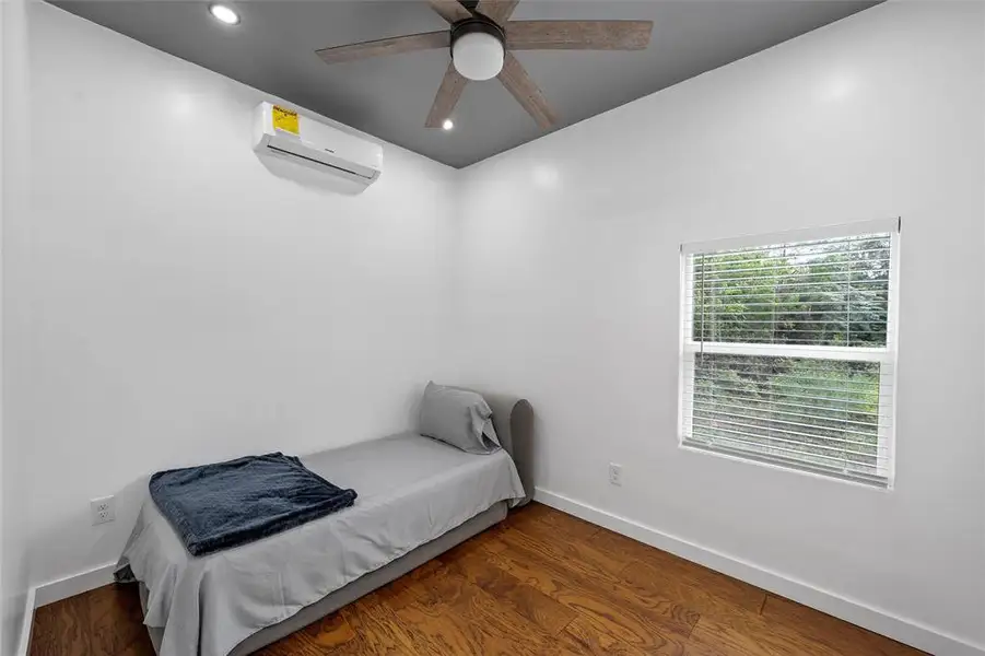 Bedroom featuring a wall Bedroom featuring a wall