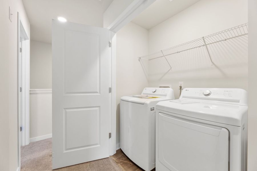 A laundry room with a washer and dryer.