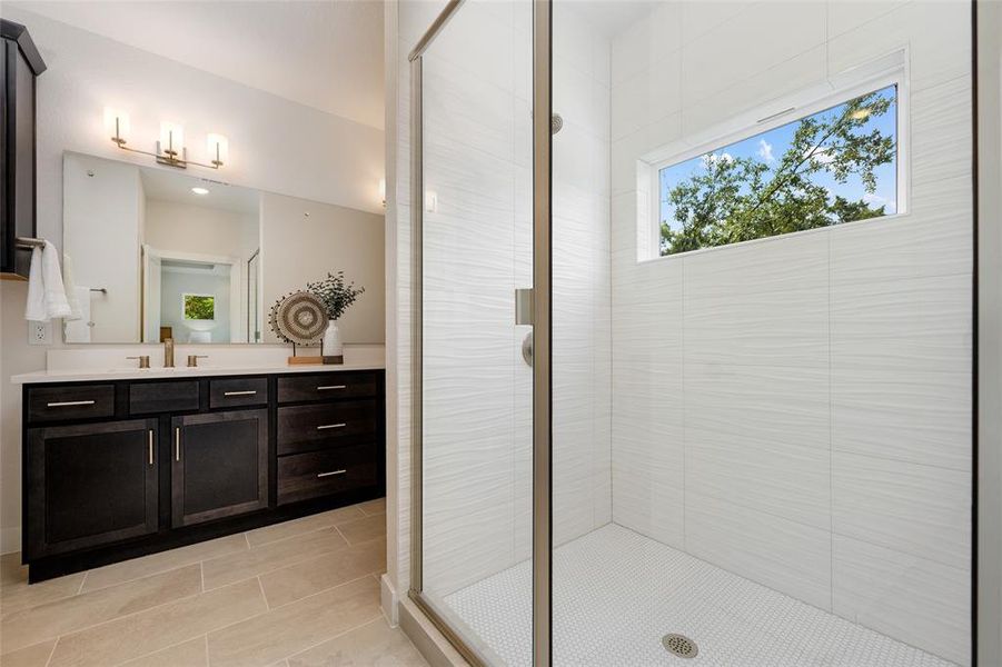 Revitalize and renew in spa-like bathroom bathed in natural light.