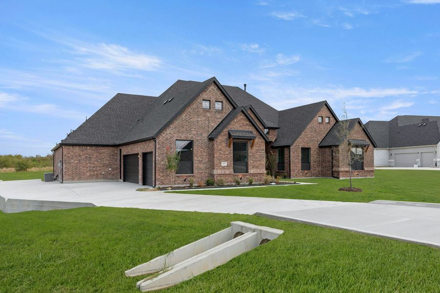 Front exterior of a new home in Berkshire Estates, Mesquite, TX, highlighting curb appeal (Image 24). Front exterior of a new home in Berkshire Estates, Mesquite, TX, highlighting curb appeal (Image 24).