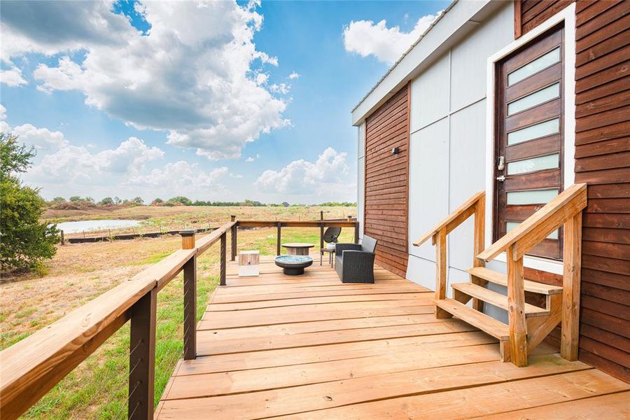 Wooden terrace featuring a view of rural / pastoral area Wooden terrace featuring a view of rural / pastoral area