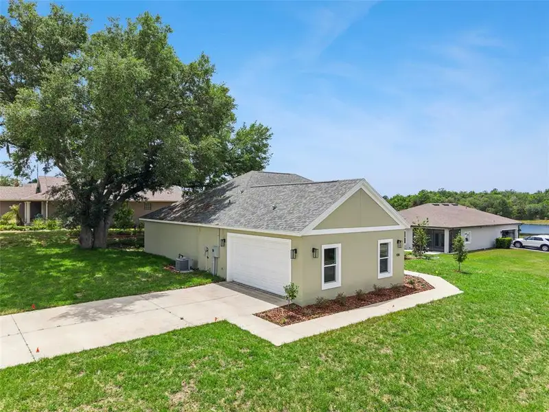 Front exterior of a new home in , Umatilla, FL, highlighting curb appeal (Image 1). Front exterior of a new home in , Umatilla, FL, highlighting curb appeal (Image 1).