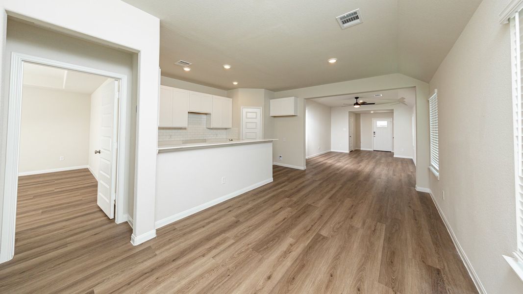 Dining Area to Kitchen and Family Room Dining Area to Kitchen and Family Room