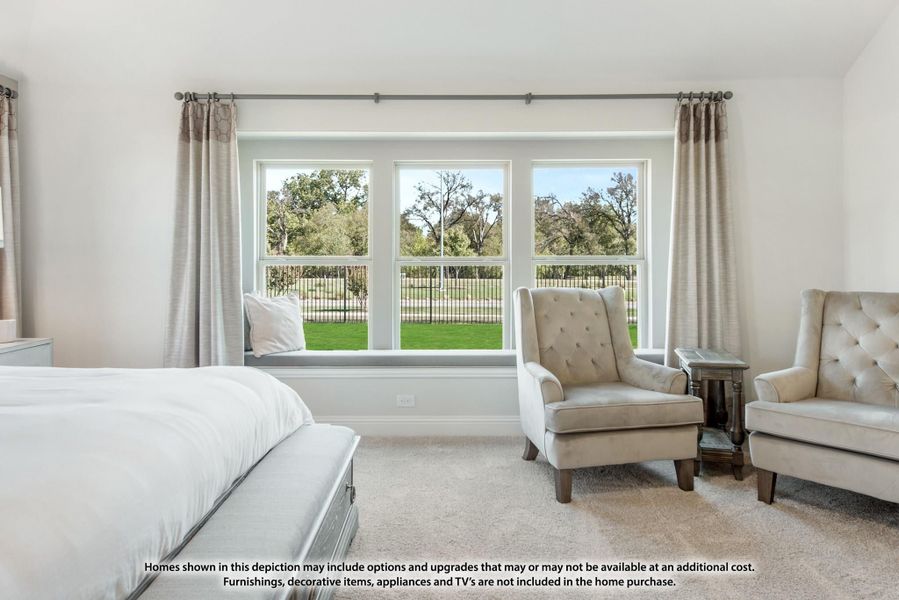 Bedroom with window seat, two armchairs, and large triple window overlooking green yard Bedroom with window seat, two armchairs, and large triple window overlooking green yard
