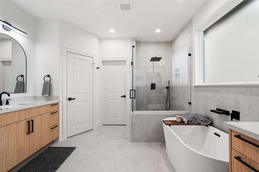 Sleek glass and precisiontilework create a modernsanctuary where every line andsurface feels intentional.