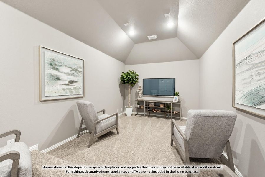 Sitting room with vaulted ceiling, gray accent chairs, TV console, and carpet flooring Sitting room with vaulted ceiling, gray accent chairs, TV console, and carpet flooring