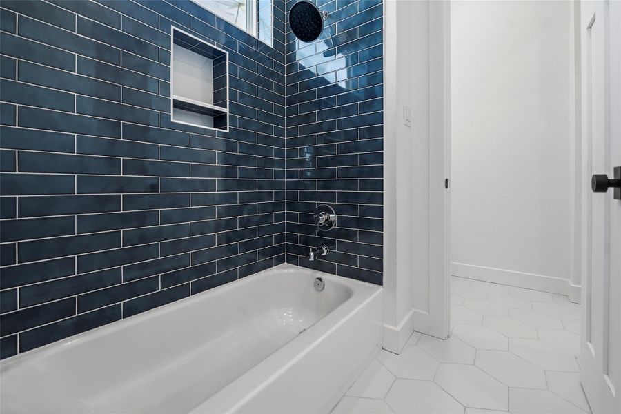 Stylish Jack & Jill bathroom with modern finishes and convenient dual access.