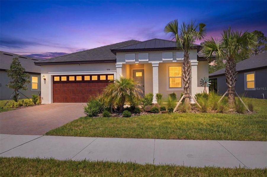 Front exterior of a new home in Angeline Active Adult, Land O' Lakes, FL, highlighting curb appeal (Image 2).