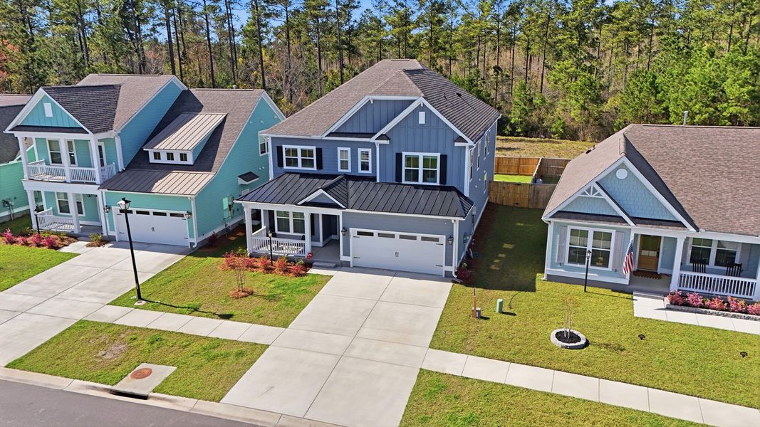 Front exterior of a new home in Tidewater at Lakes of Cane Bay, Summerville, SC, highlighting curb appeal (Image 27).