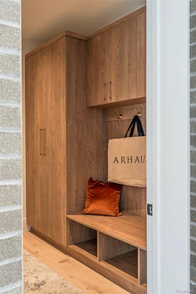 Mud room connecting to the oversized 2 car garage with extra storage space