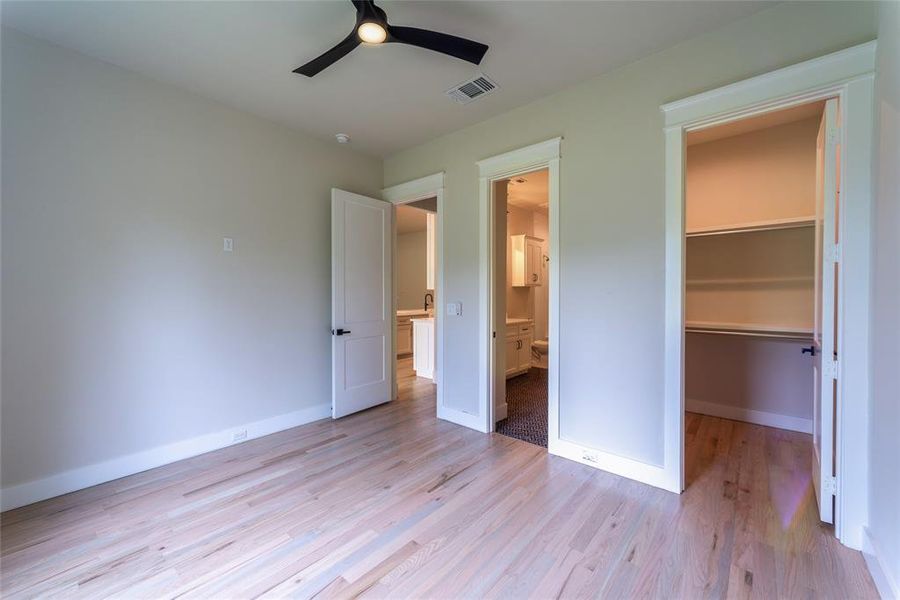 Guest room to bath, hall, and walk-in closet.