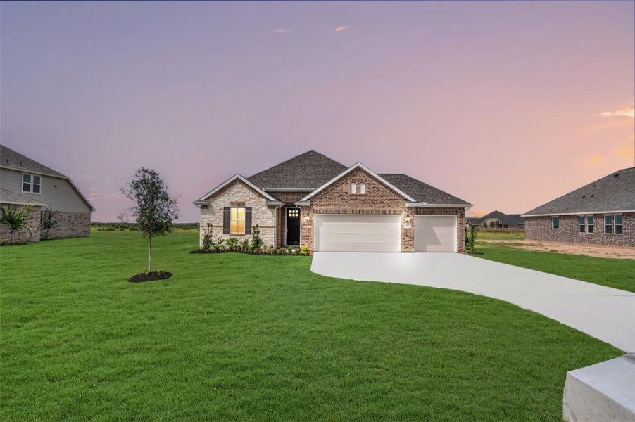 Front exterior of a new home in Cane Crossing Estates, Sealy, TX, highlighting curb appeal (Image 2). Front exterior of a new home in Cane Crossing Estates, Sealy, TX, highlighting curb appeal (Image 2).