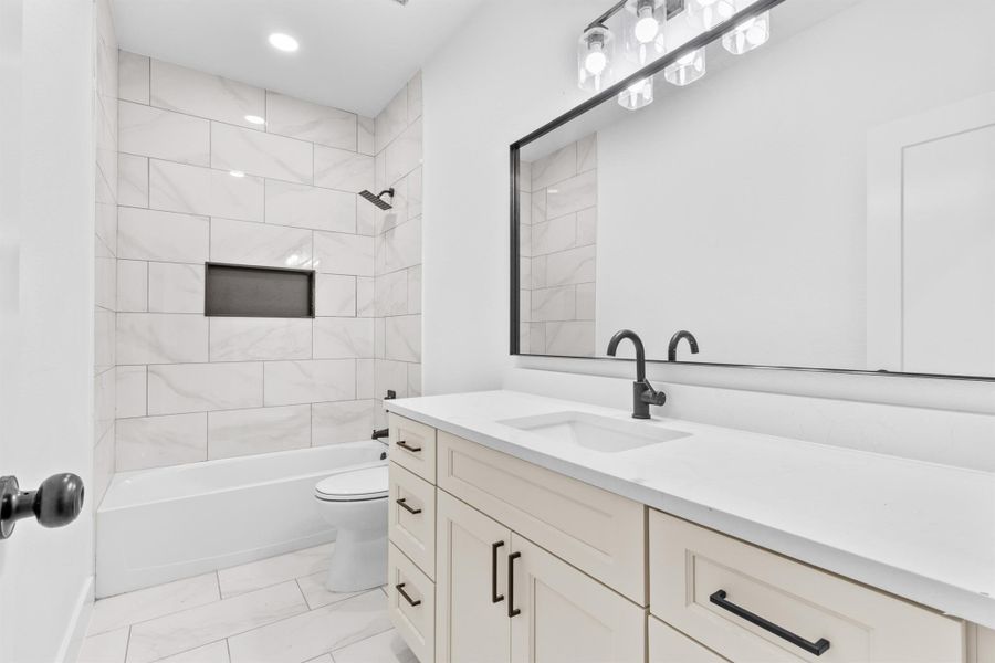 Full bathroom with vanity and shower / tub combination