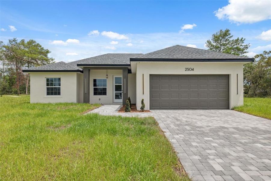 Front exterior of a new home in , Ocala, FL, highlighting curb appeal (Image 26).