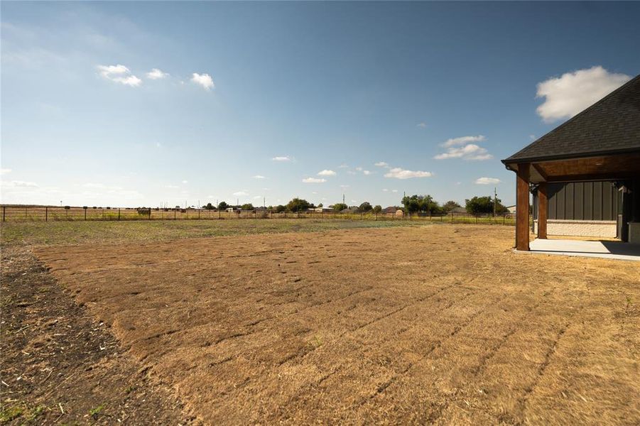 View of yard featuring a view of countryside and a patio