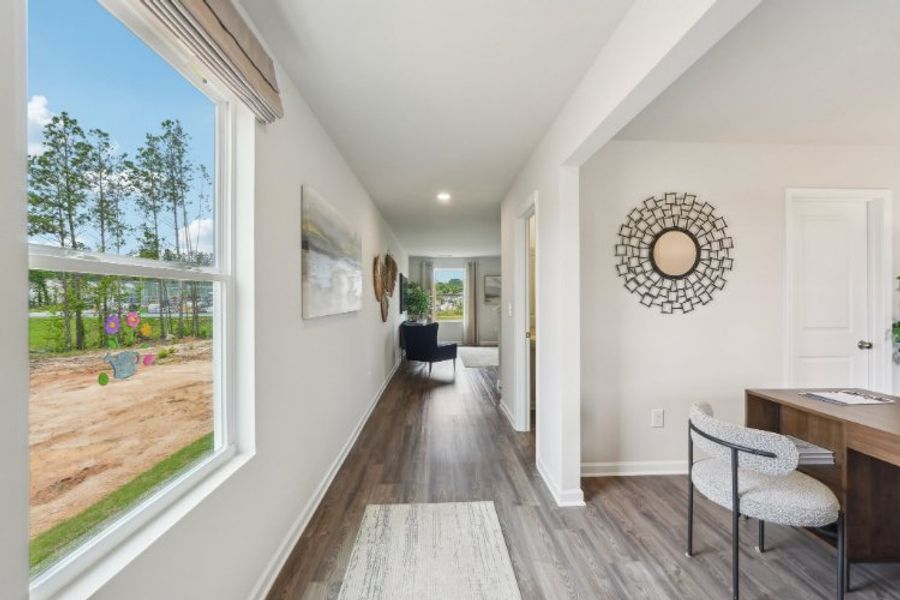 A room with a table and chairs.