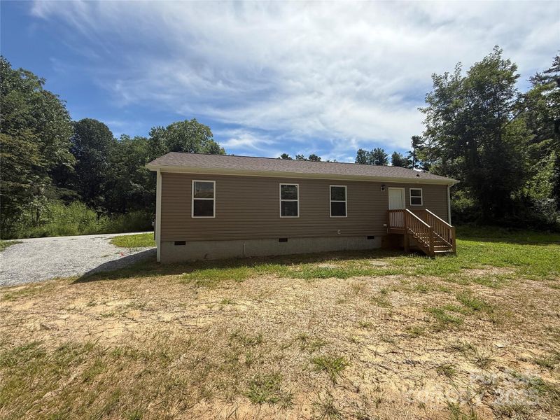 Front exterior of a new home in , Hendersonville, NC, highlighting curb appeal (Image 1).