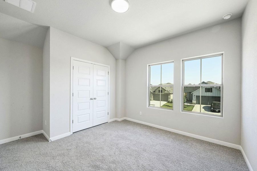 Bedroom in the Willow home plan by Trophy Signature Homes – REPRESENTATIVE PHOTO