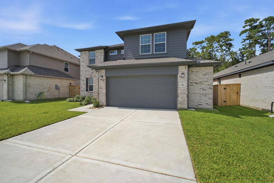 Front exterior of a new home in Sundance Cove, Crosby, TX, highlighting curb appeal (Image 2). Front exterior of a new home in Sundance Cove, Crosby, TX, highlighting curb appeal (Image 2).