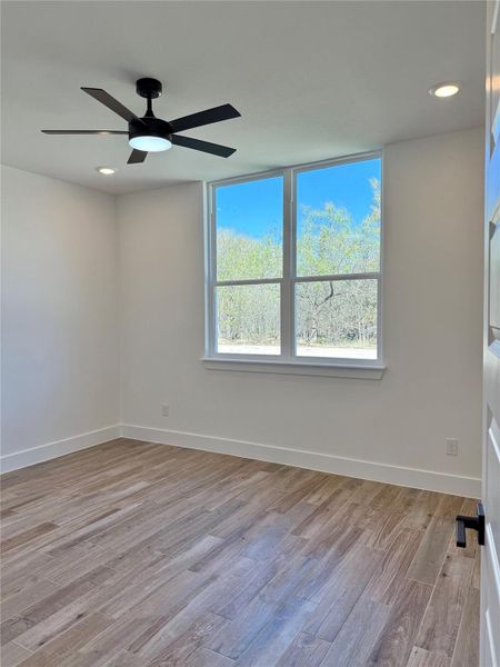 Unfurnished room with recessed lighting, light wood-type flooring, and ceiling fan
