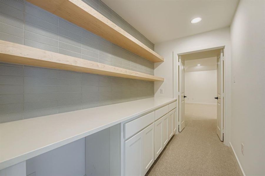 Hall with light colored carpet and recessed lighting Hall with light colored carpet and recessed lighting