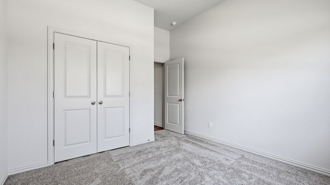 Furnished interior view inside a new home in Green Meadows Premier, Celina (Image 7).