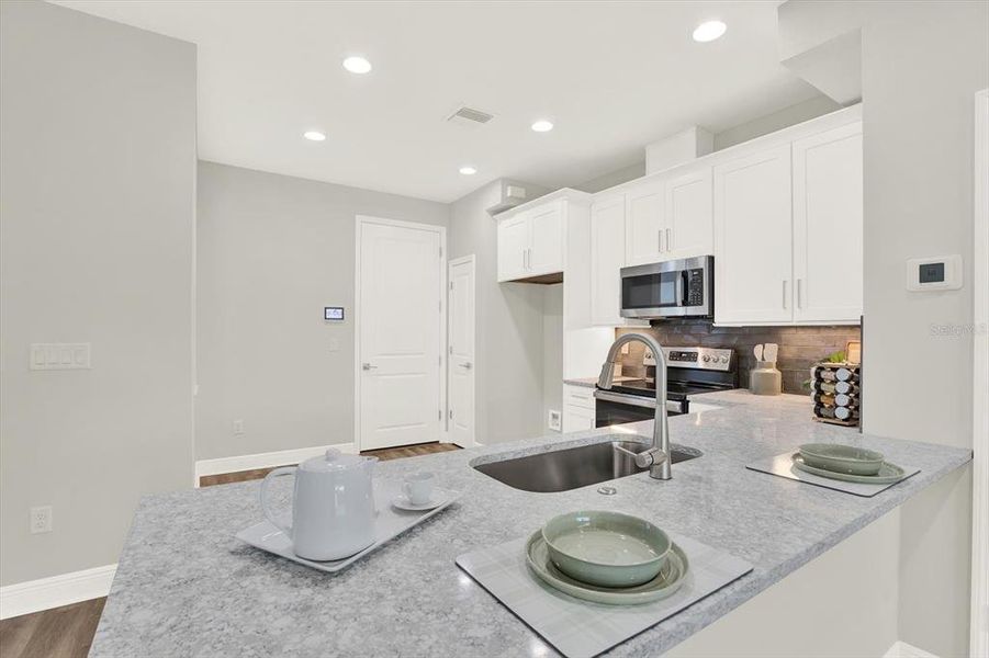 Furnished interior view inside a new home in The Towns At Long Bayou, Seminole (Image 16).