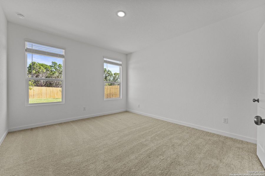 Spacious, unfurnished interior of a new home in Waterwheel: Coastline Collection, San Antonio (Image 18).