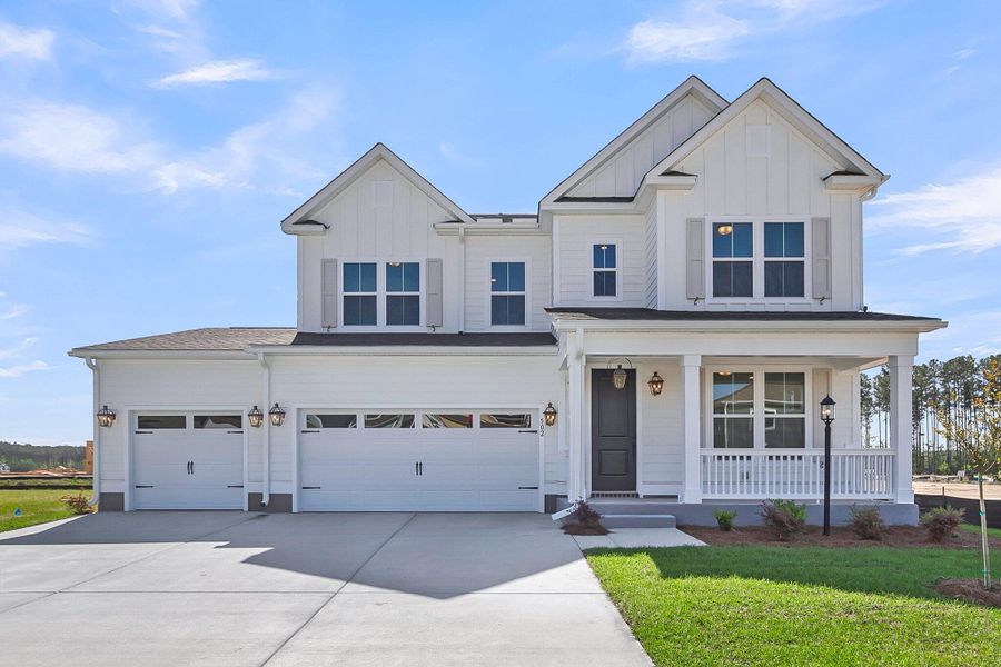Front exterior of a new home in Tidewater at Lakes of Cane Bay, Summerville, SC, highlighting curb appeal (Image 1). Front exterior of a new home in Tidewater at Lakes of Cane Bay, Summerville, SC, highlighting curb appeal (Image 1).