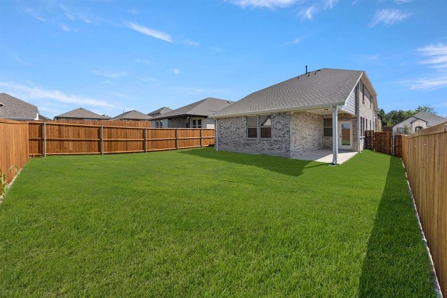 Exterior details and patio area of a home in Devonshire 40s, Forney (Image 17).