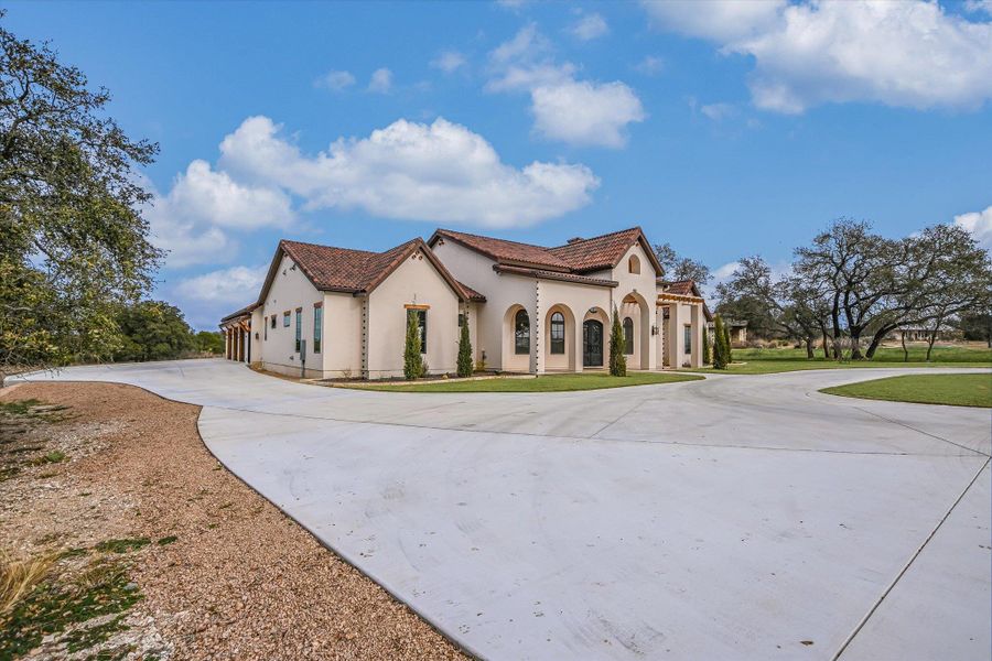 Front exterior of a new home in , Burnet, TX, highlighting curb appeal (Image 2). Front exterior of a new home in , Burnet, TX, highlighting curb appeal (Image 2).