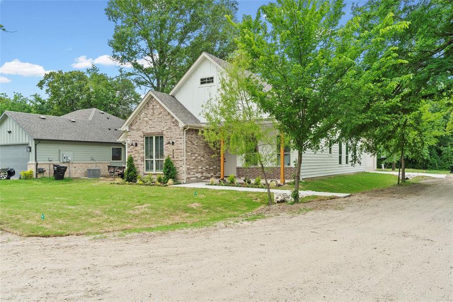 Front exterior of a new home in , West Tawakoni, TX, highlighting curb appeal (Image 23).