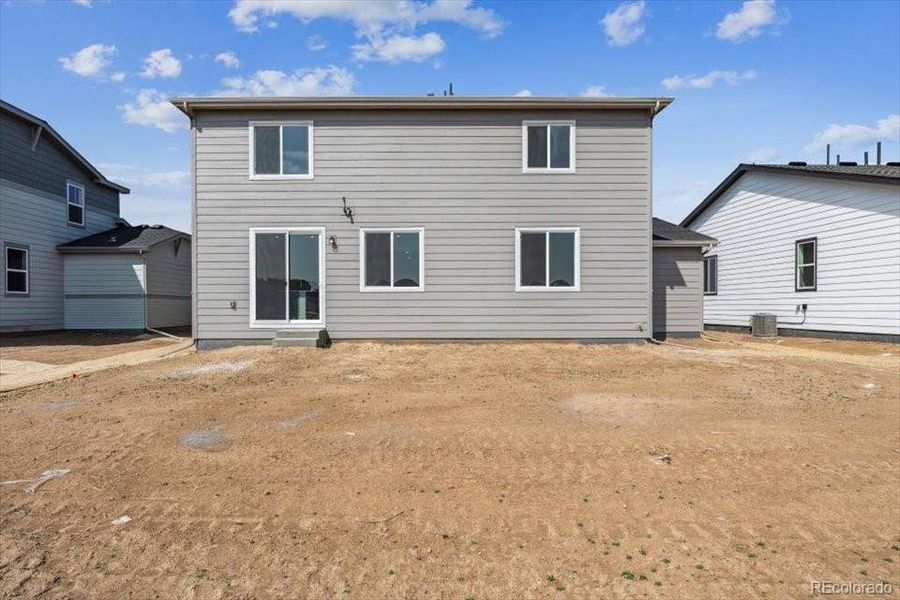 Front exterior of a new home in Red Barn Meadows, Mead, CO, highlighting curb appeal (Image 18).