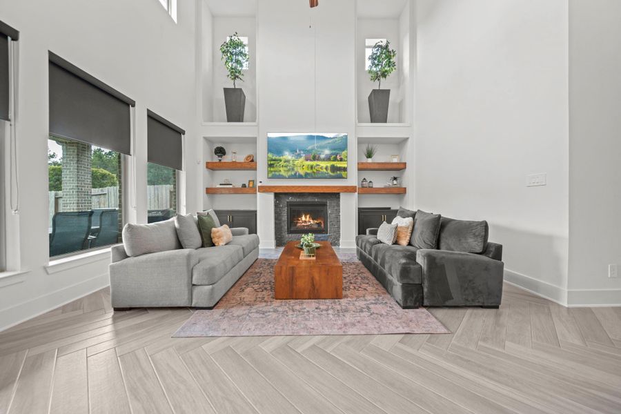 A well-designed living space featuring built-in shelving, natural light, and a cozy fireplace—ideal for both entertaining and relaxing. A well-designed living space featuring built-in shelving, natural light, and a cozy fireplace—ideal for both entertaining and relaxing.